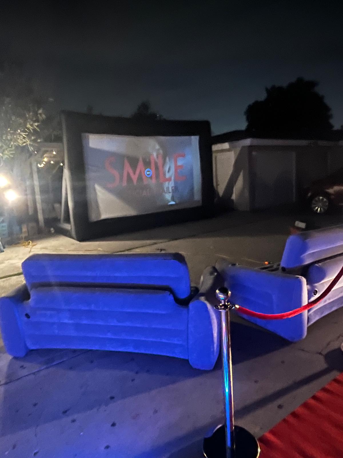 Red-carpet backyard movie premiere setup